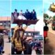 Unique scenes as a newlywed couple and their bridesmaids are ferried in a loader