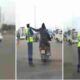 Moment motorbike riding thugs snatched phone from policeman directing traffic scaled 1