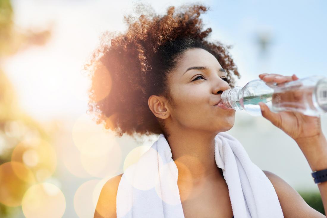 drinking water after a workout in the sun