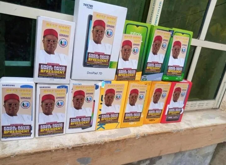 Governor David Umahi campaign posters for 2023 presidency on smartphones