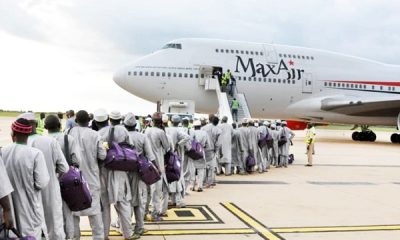 pilgrims board their flight to Saudi Arabia for the Hajj