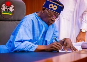 tinubu writes signs 1536x1097 1