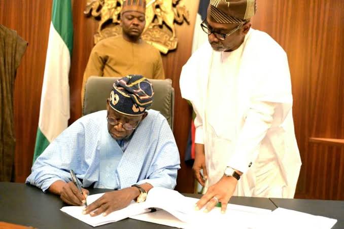 Bola Tinubu signs