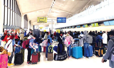Nigerian returnees from the United State of America during their arrival at the Nnmadi Azikiwe International Airport in Abuja. on Sunday1