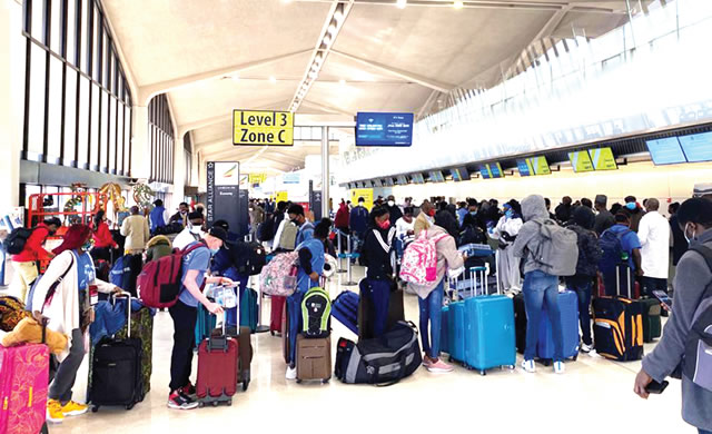 Nigerian returnees from the United State of America during their arrival at the Nnmadi Azikiwe International Airport in Abuja. on Sunday1