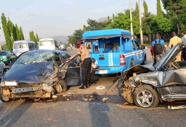 Road safety men at accident scene