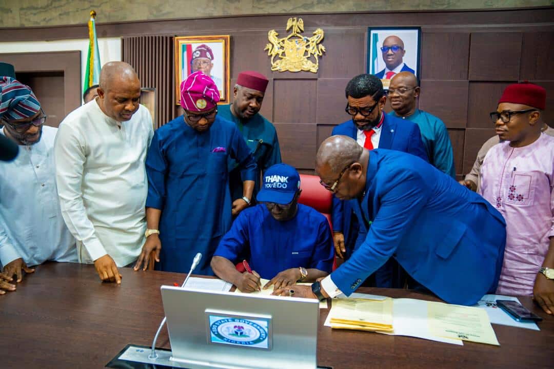 Governor Monday Okpebholo signing