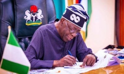 Tinubu signs writes 2