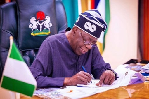 Tinubu signs writes 3