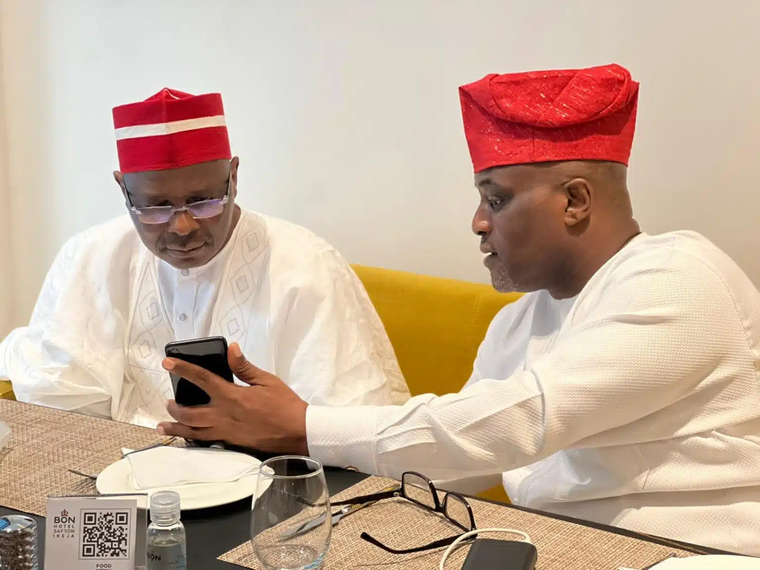 Former National Publicity Secretary of the New Nigeria Peoples Party Ladipo Johnson and his principal and ex Kano State Governor Rabiu Kwankwaso at a recent meeting